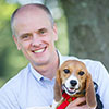 Dr. Travis holding his beagle puppy