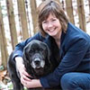 Dr. Brown with her spotted black and white dog