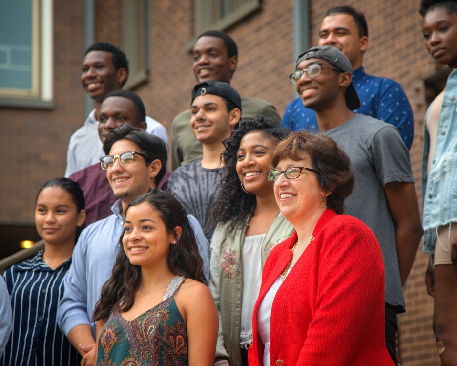 president with a collection of students