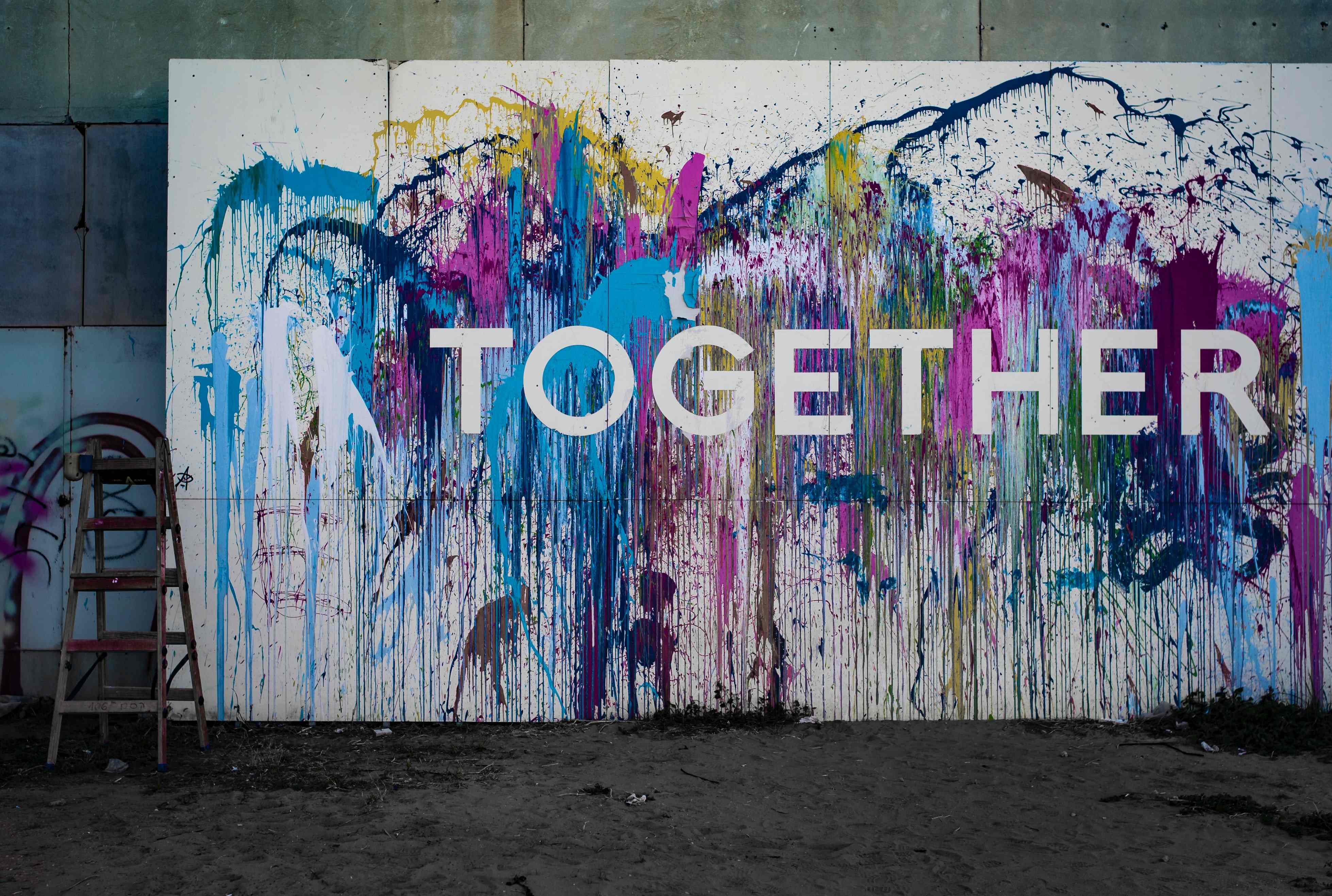 A mural that reads 'Together'