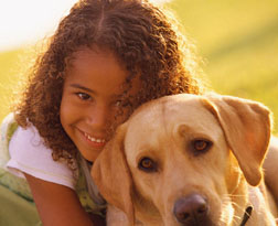 girl with yellow lab