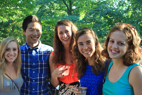 4 women and 1 man smiling