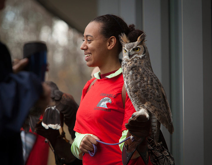 Woman holding an owl