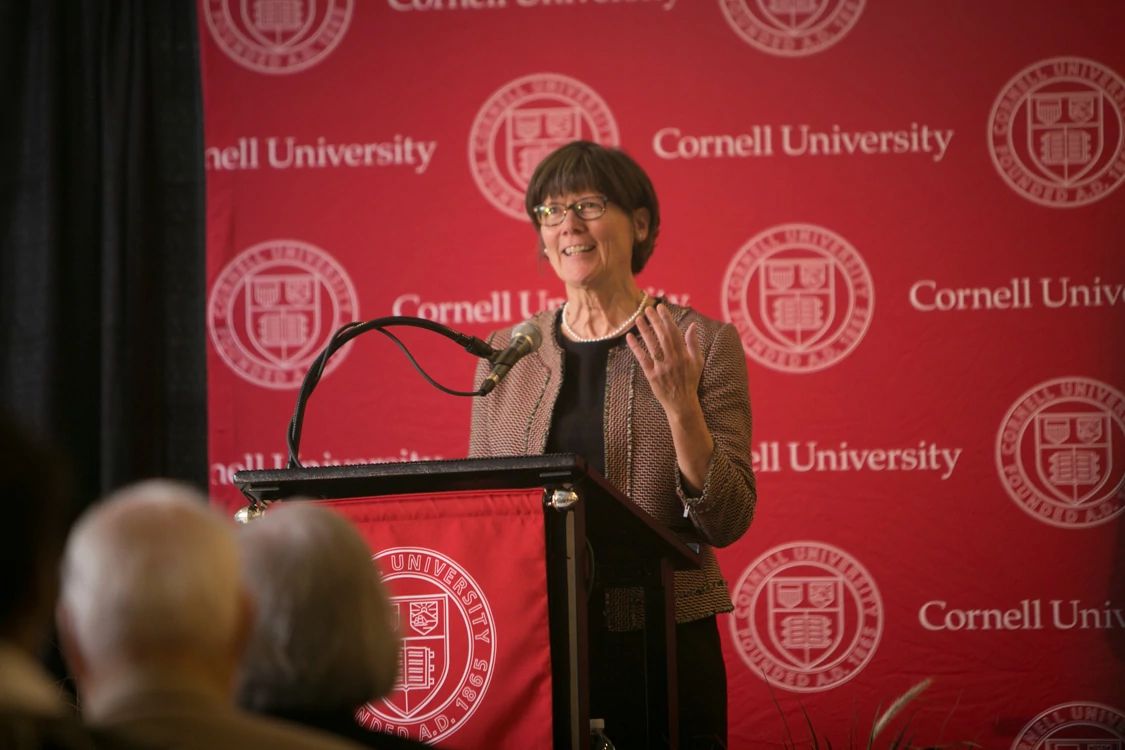 Judy Appleton speaking at a podium