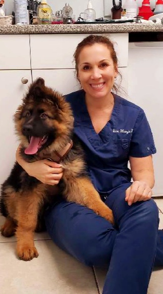 DiGrazia sitting with a fluffy dog