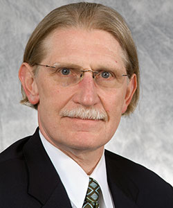 A headshot of Dr. Dwight Bowman, Veterinary Parasitologist.