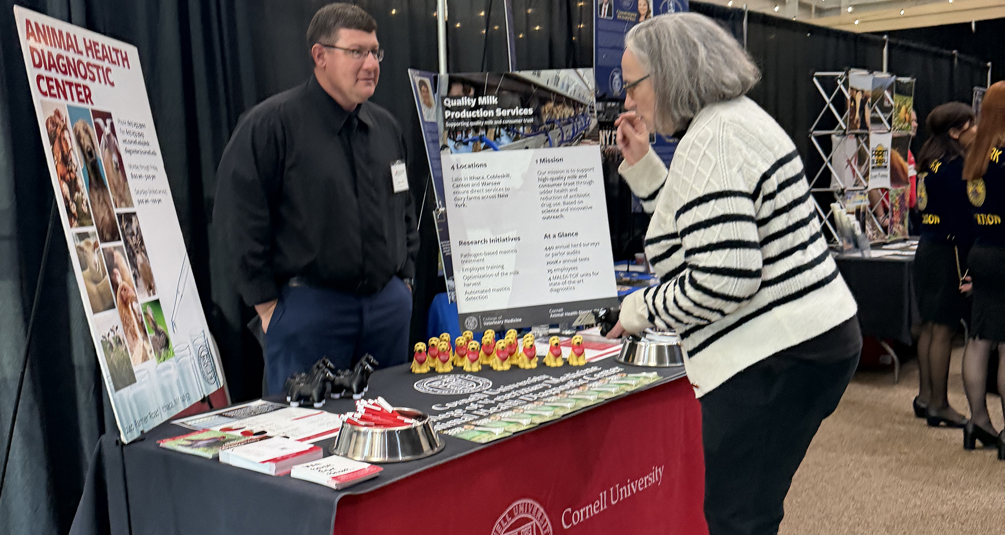 A staff member of the AHDC speaks to a forum attendee