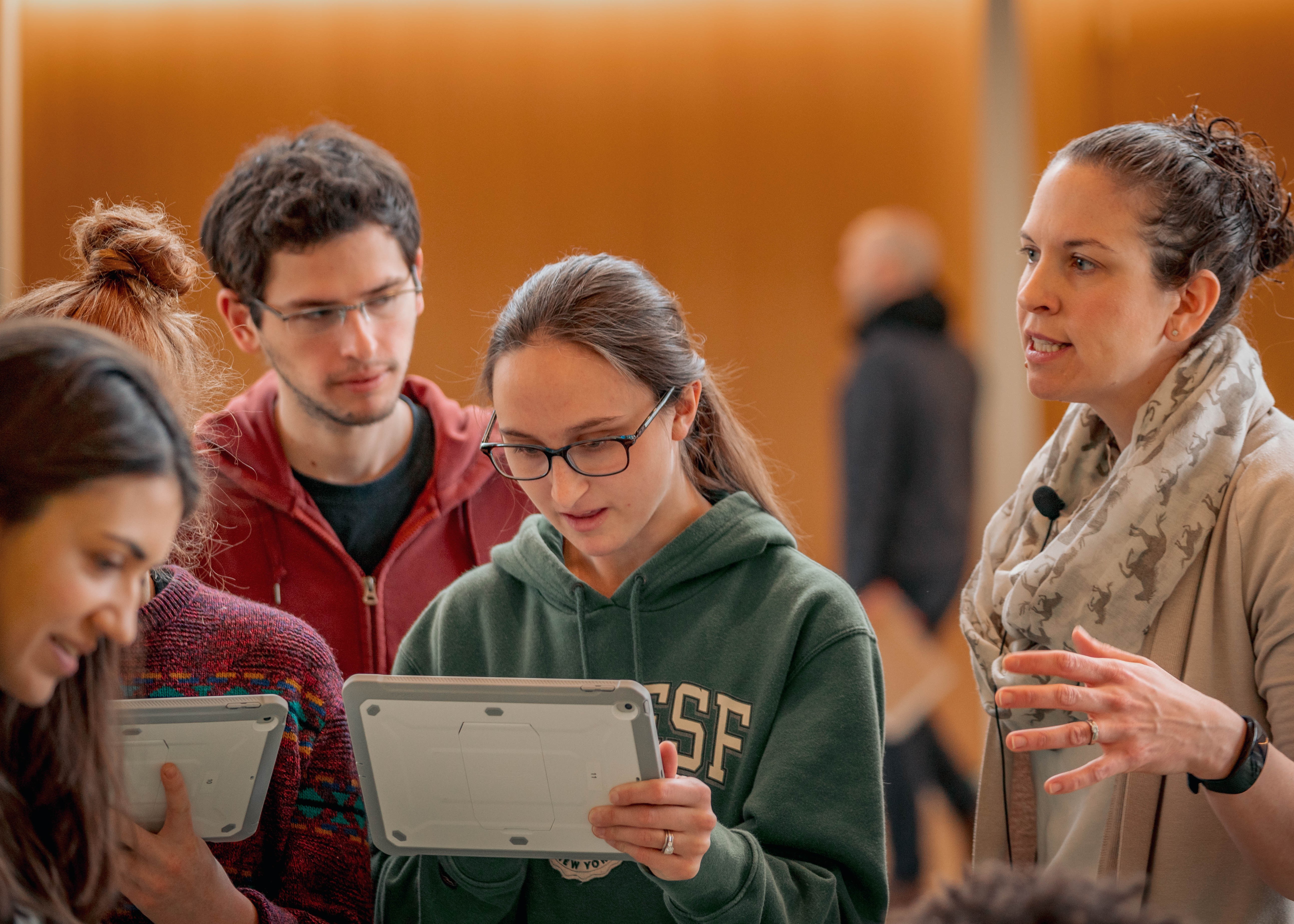 Dr. Miller instructing students on tablets