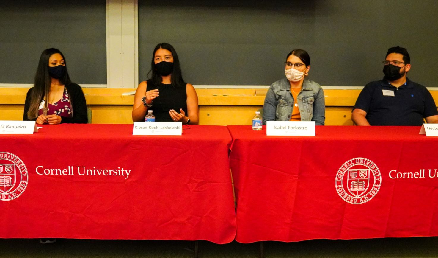 grad students sit at a table 