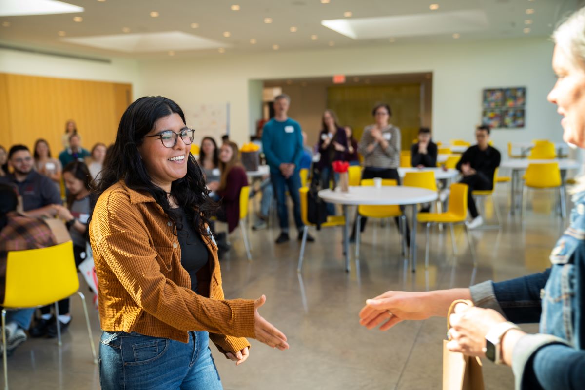 BBS student goes to shake hands at ceremony