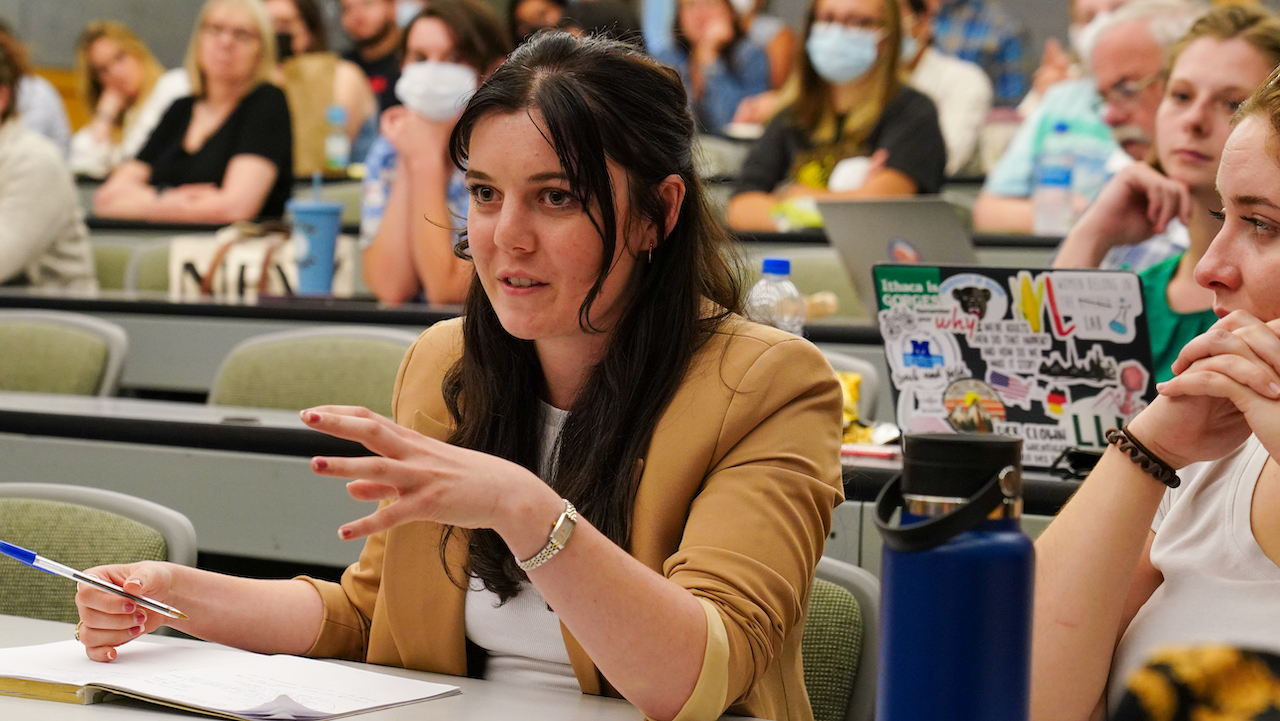 A student asks a question during a BBS symposium presentation