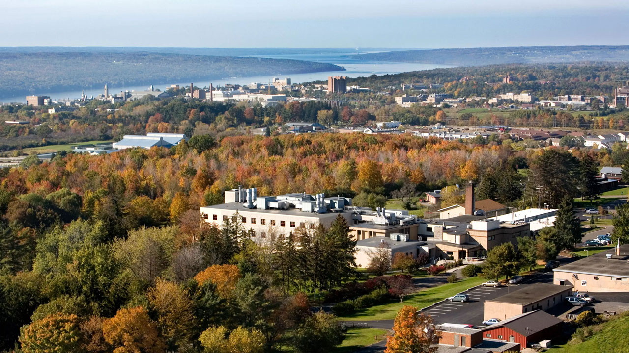 Baker Institute from the air with Cayuga Lake in the distance