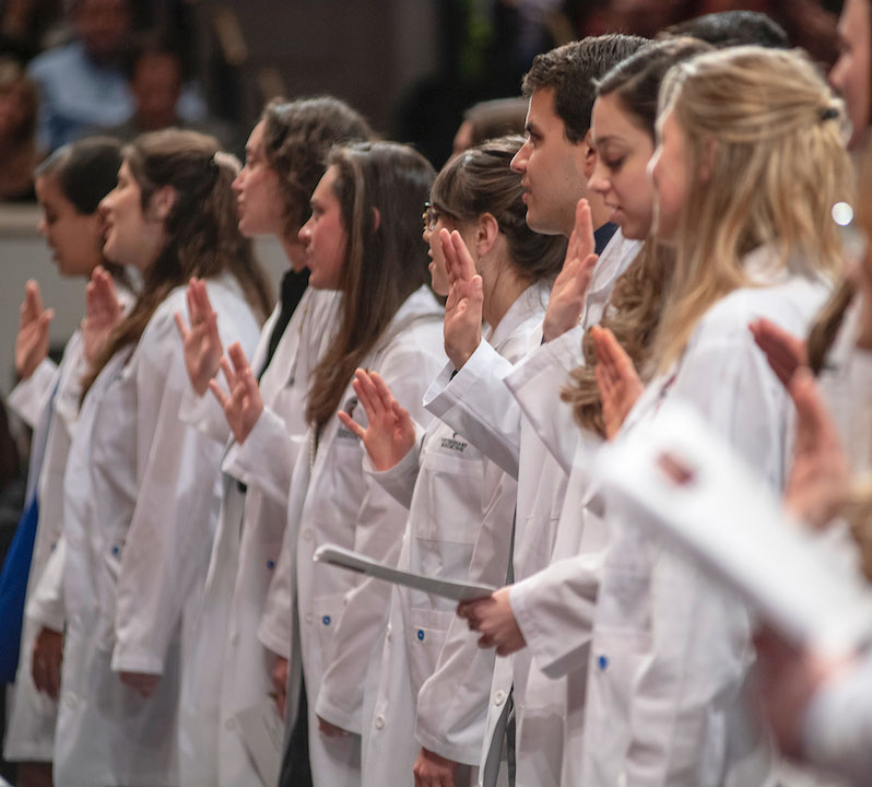 Students recite the Veterinarian's Oath during the 2019 white coat ceremony