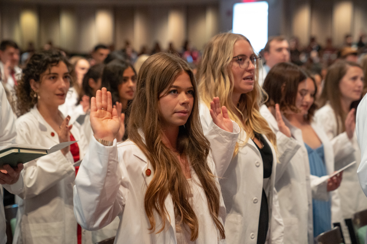 Students taking an oath