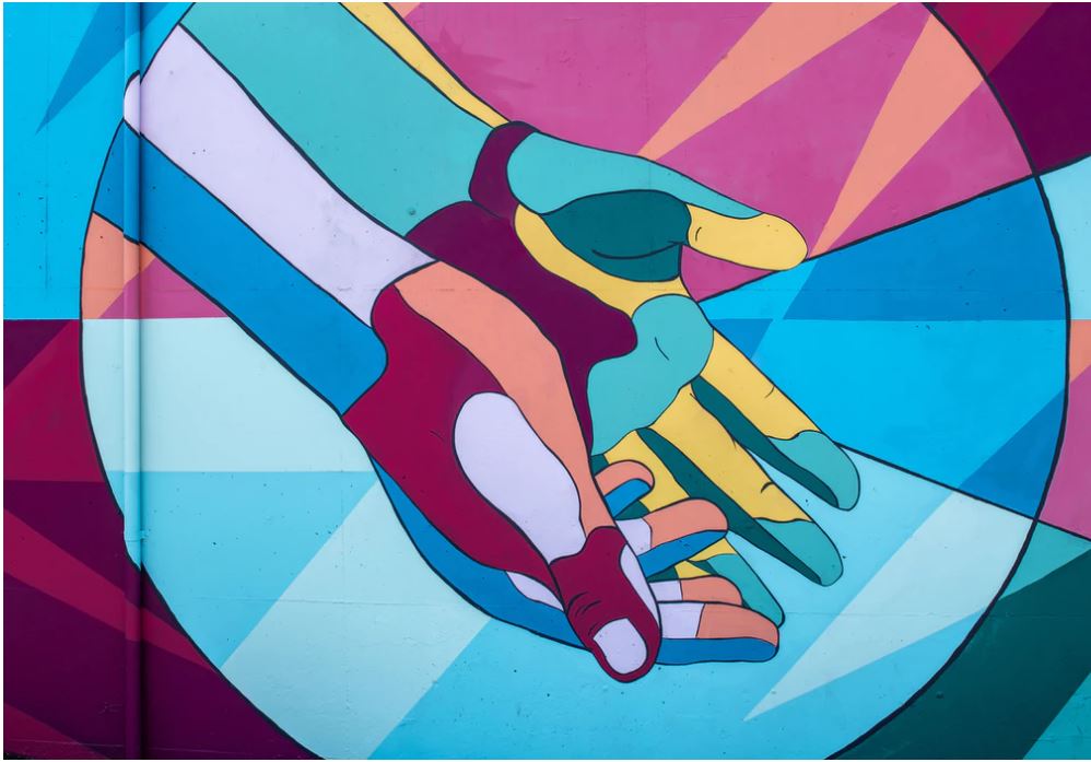a painted mural of colorful hands