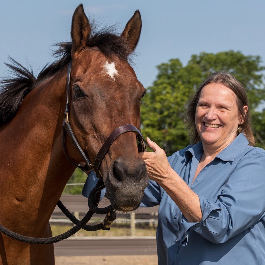 Cornell Veterinary Biobank team member, Denise Archer with a horse at Oxley Equestrian Center.
