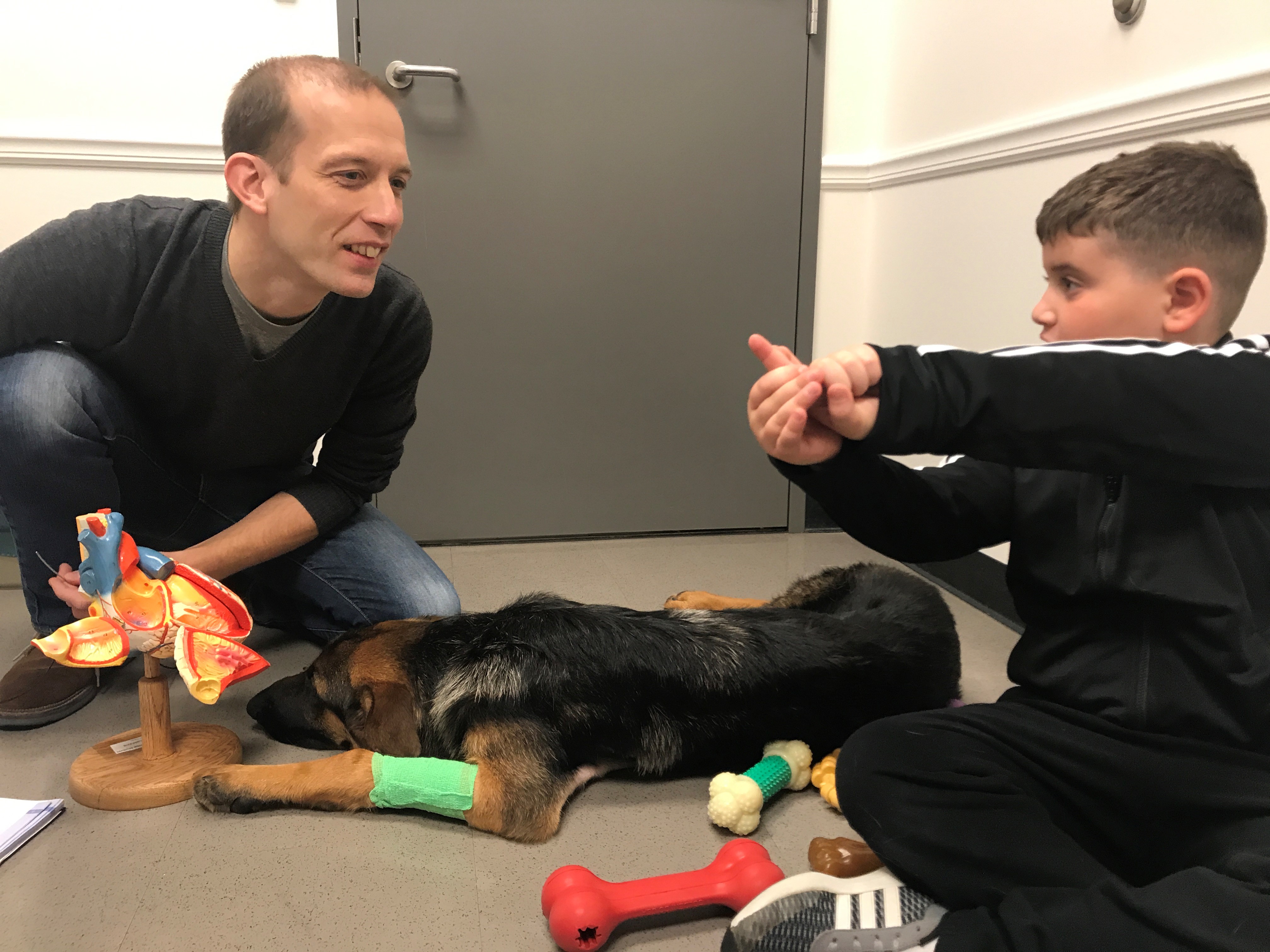 Romain Pariaut teaches Karen Silverman's son about the procedure with Rex