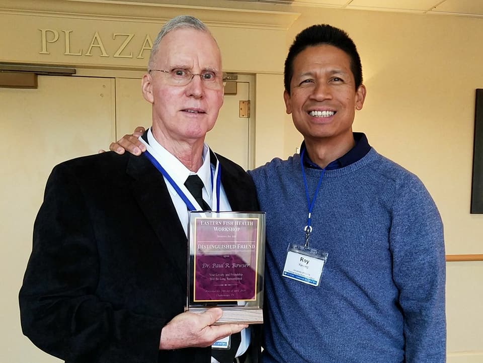 Paul Bowser receives his award at the Eastern Fish Health Workshop