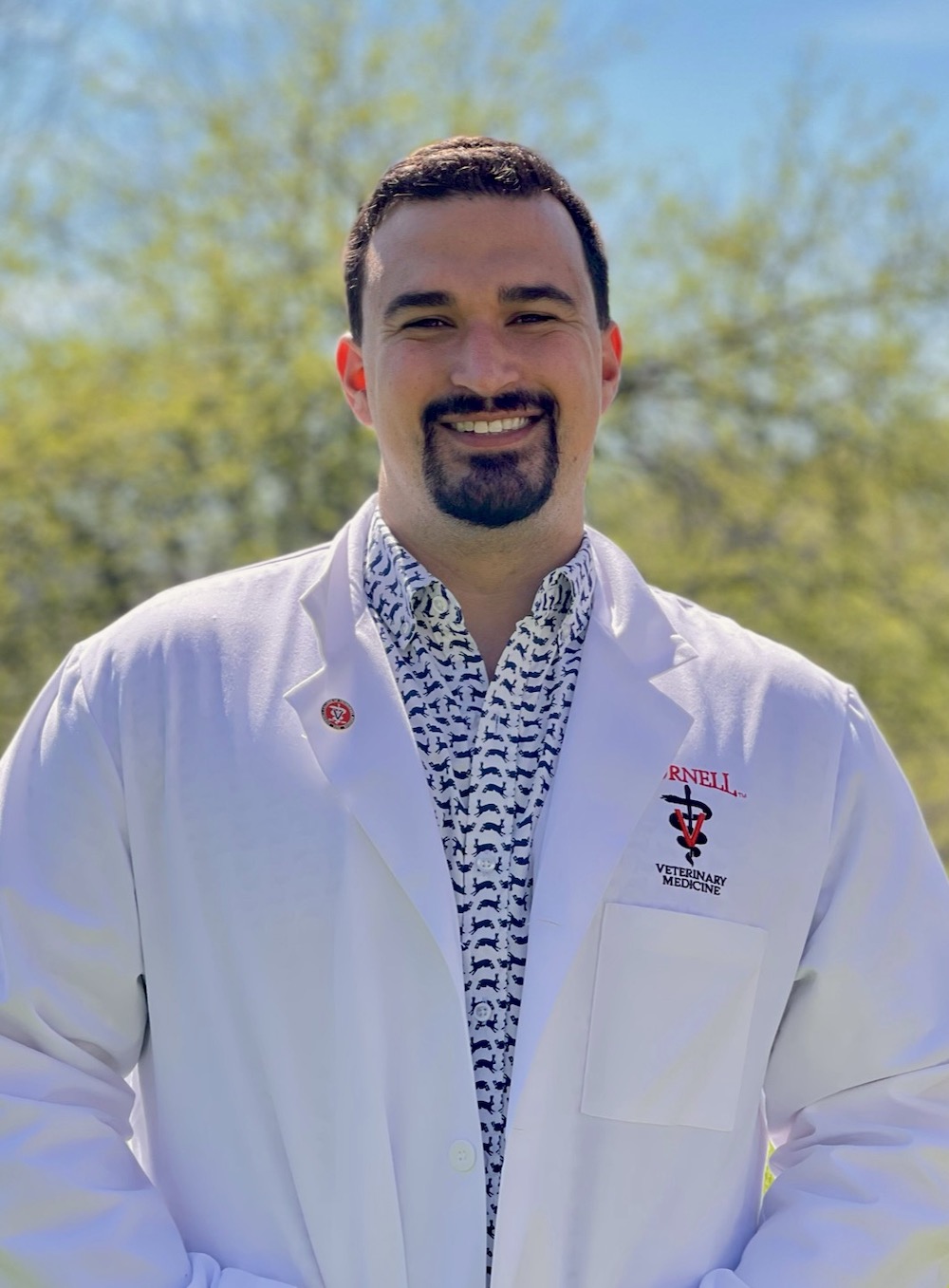 Xanth El-Sayed headshot in a Cornell white coat