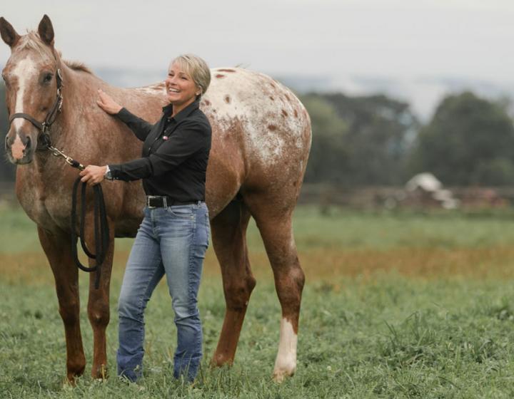 Lisa Fortier with a horse at the Cornell Equine Park