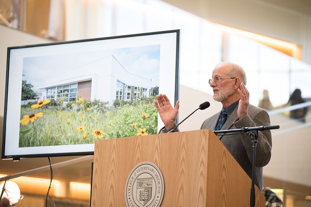 William Hornbuckle speaking at a podium at the opening the Small Animal Community Practice in 2018