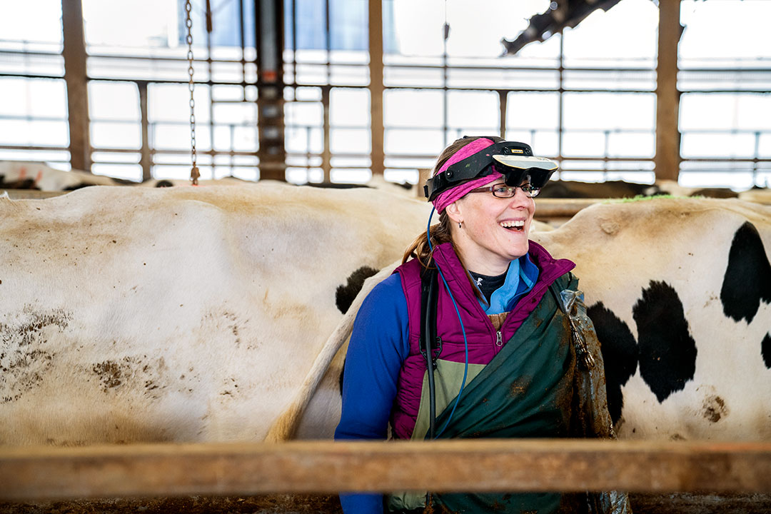 Jessica McArt working in the dairy barn