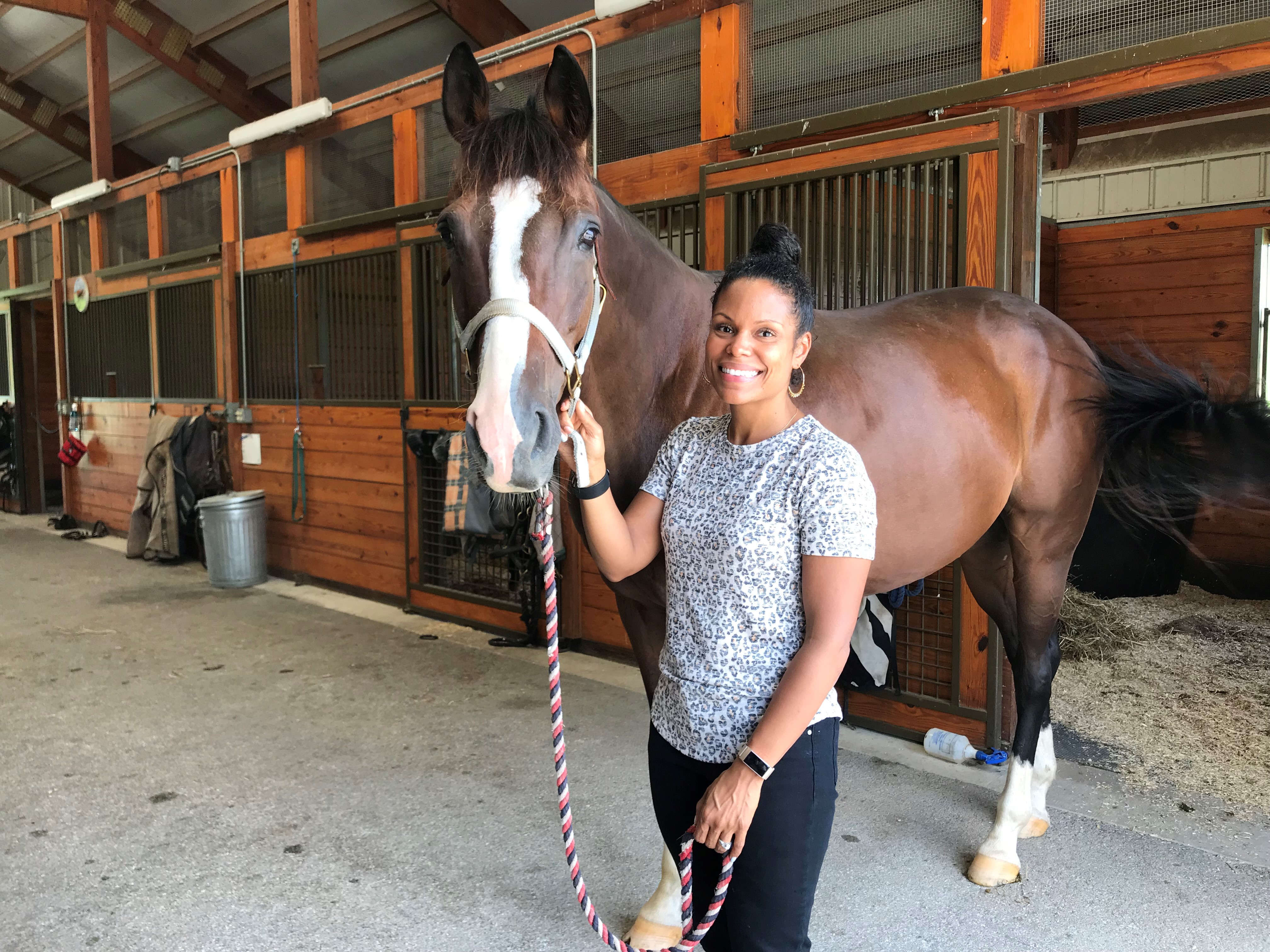 Dr. Joya Griffin with horses