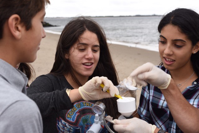 Brooklyn students collect water samples to test for the presence of invasive species