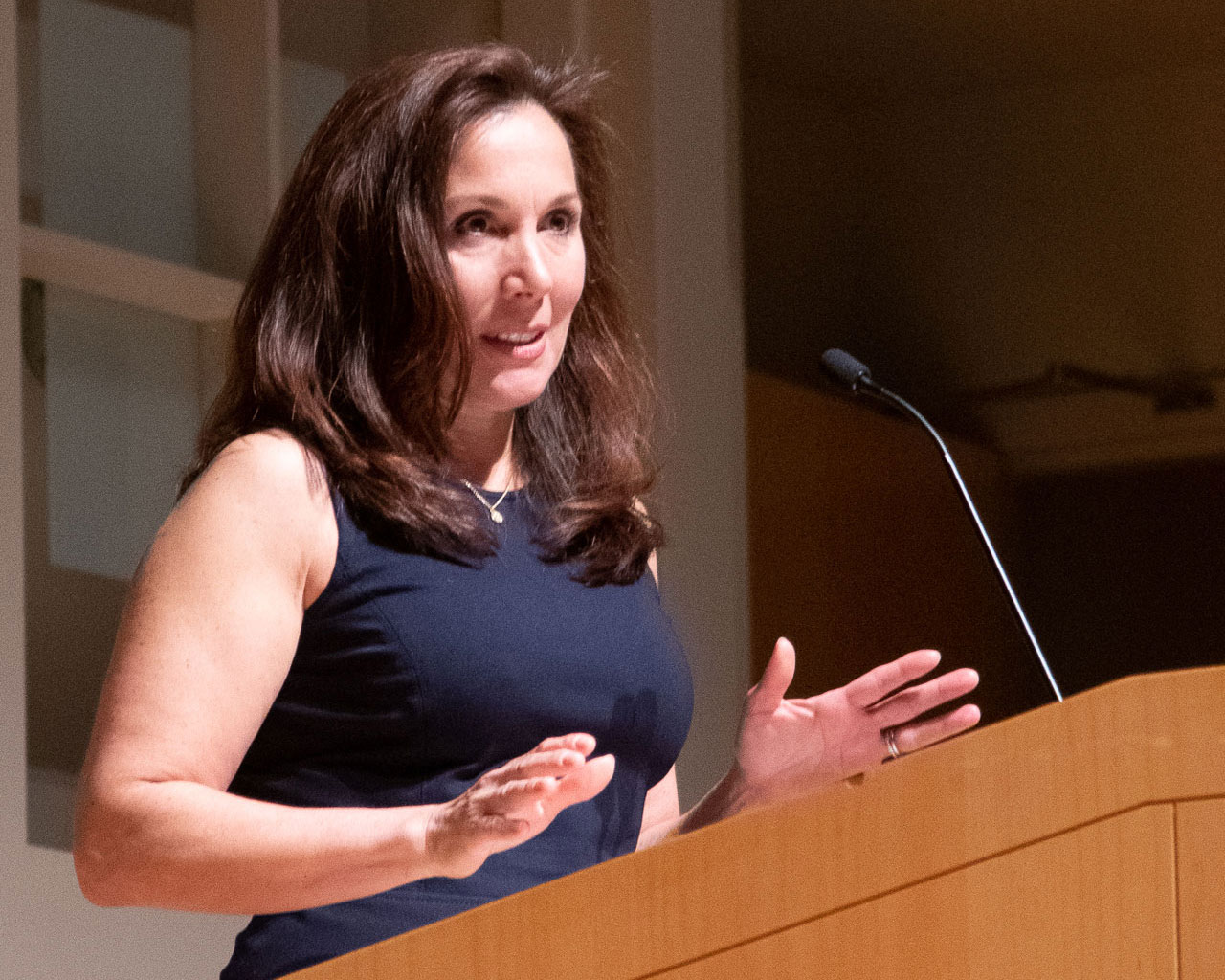 Mara DiGrazia at a podium during White Coat