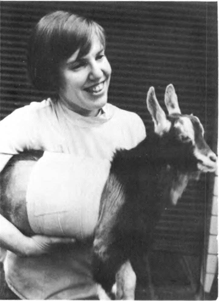 Black and white image of Mary Smith holding a goat