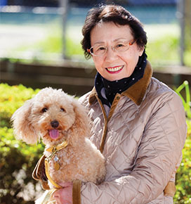 Woman holding poodle