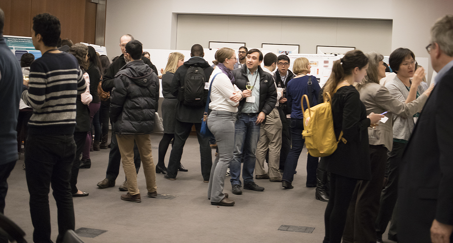 Attendees to the symposium at the poster session