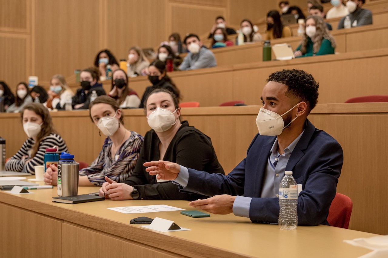 Students in masks sit in the lecture hall, ready to ask questions after a talk during the World Wildlife Day event