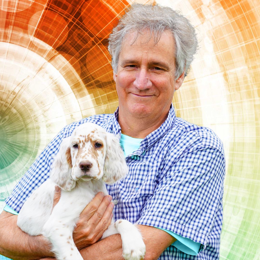 Director Scott holding canine