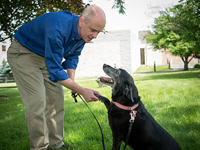 Alexander J. Travis with  pet