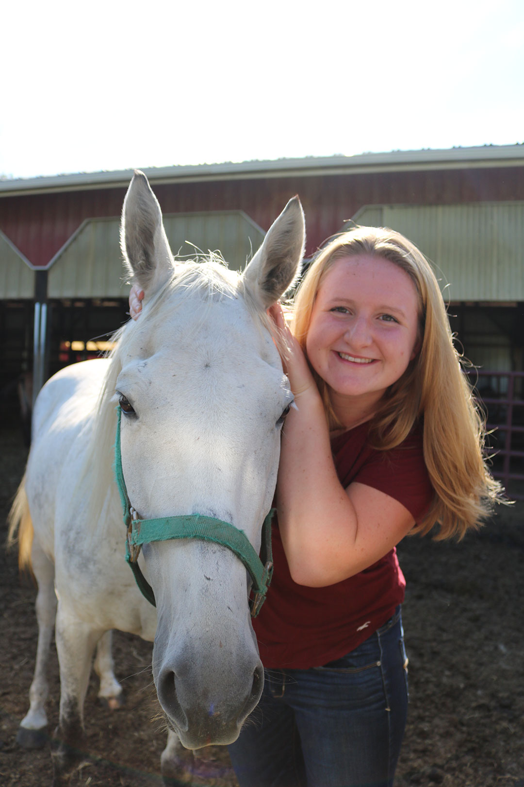 Camille Holmes with white horse