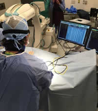 Vererinary cardiologist in the operating room using flurosocpy 