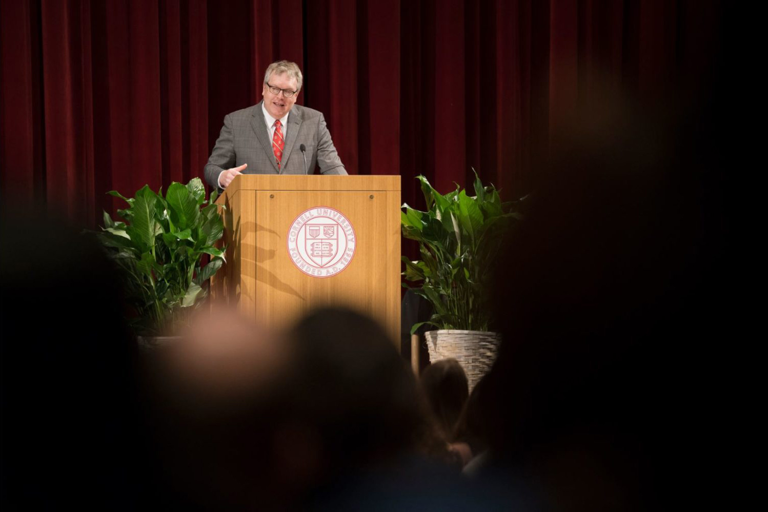 Dean Lorin Warnick speaks at a podium