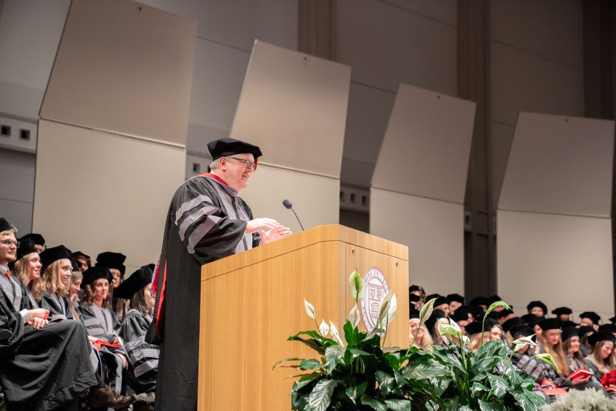 dean speaking at hooding