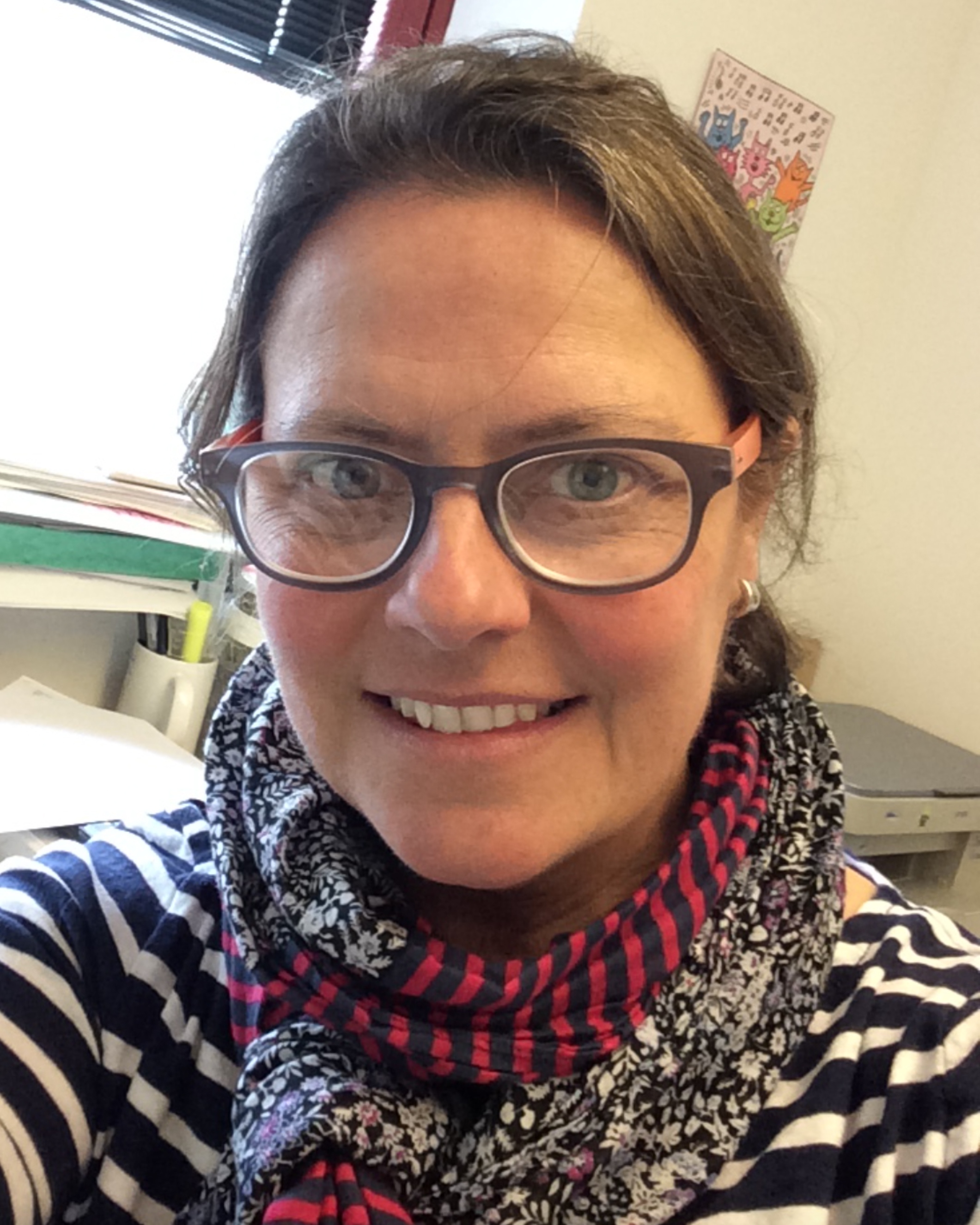 Portrait photograph of Dr. Keila Dhondt smiling at the camera