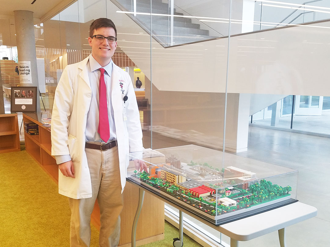 Samuel Burkhardt with the LEGO replica in the library