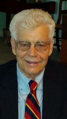 A headshot of Dr. Lein in a formal suit and tie