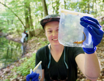 girl with salamander specimen 