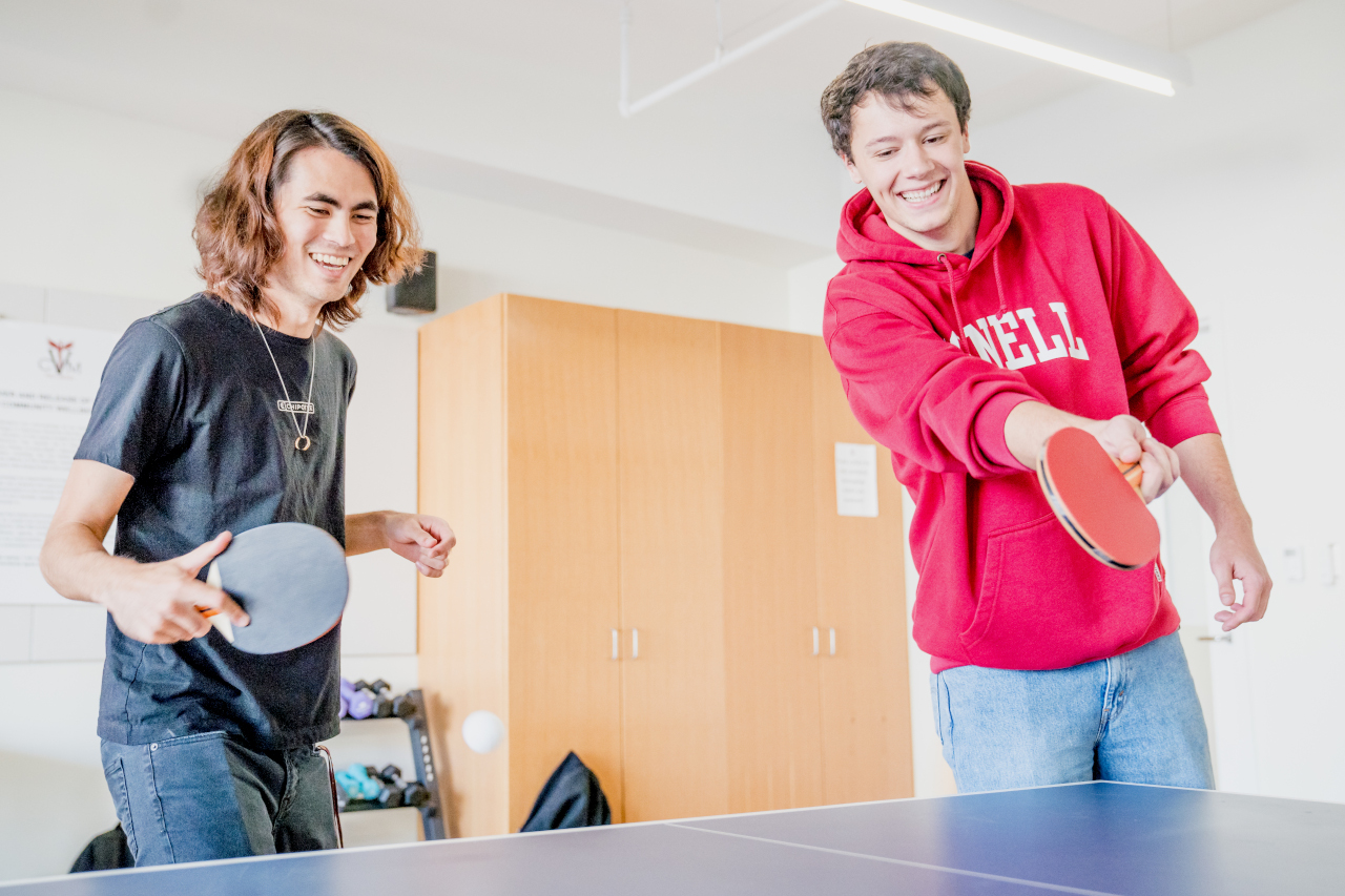 students playing ping pong in the CVM fitness room