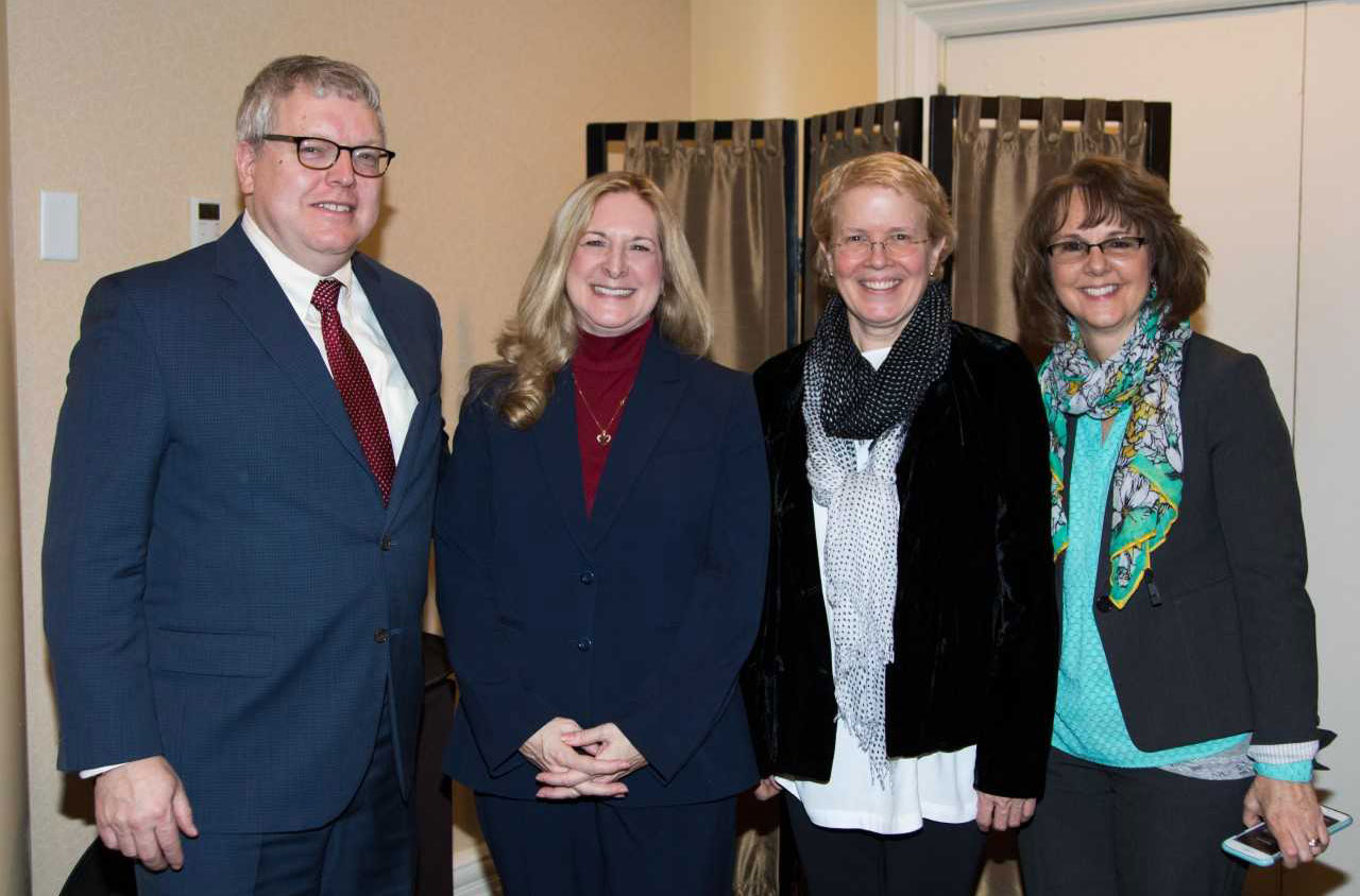 The dean with Carol Merkur and other CVM staff members at the Employee Excellence Awards