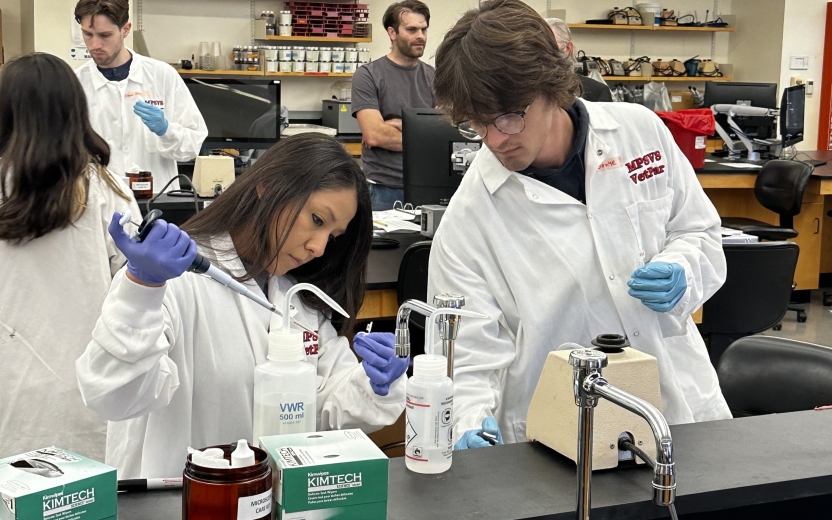 MPS Students performing laboratory work in lab coats