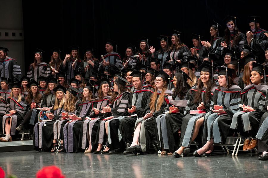 Veterinary graduates seated during the hooding ceremony