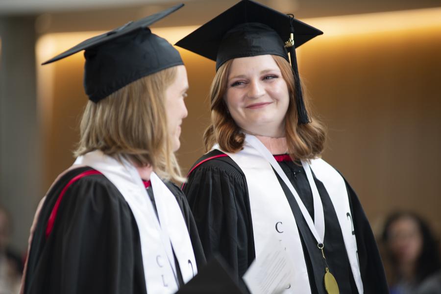 Two MPH students during their hooding ceremony