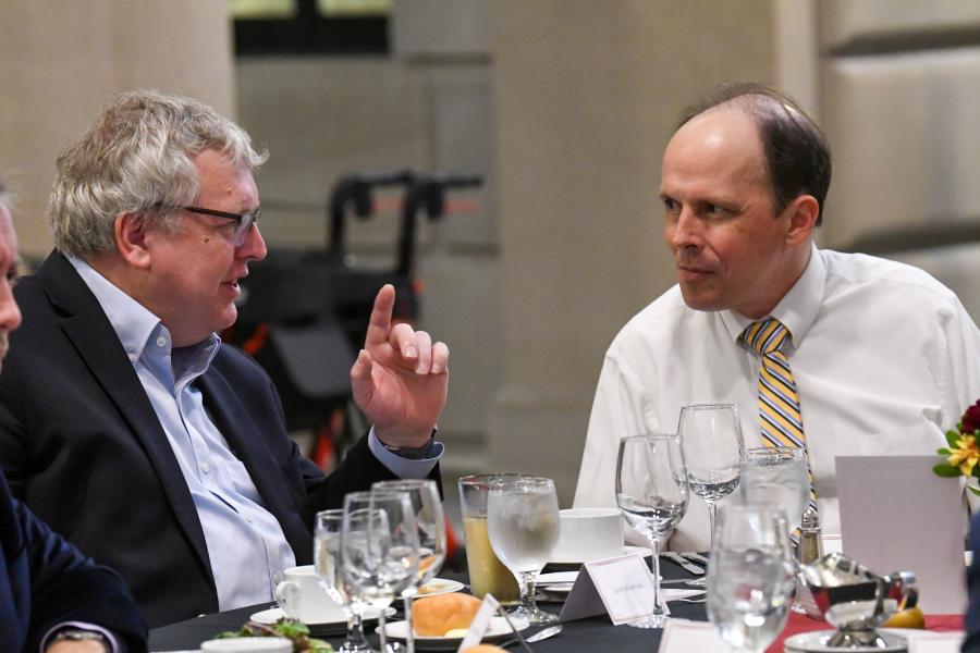 Dr. Cote in conversation with Dean Warnick at dinner