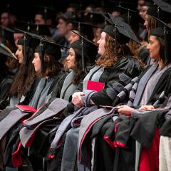 Graduates seated at hooding ceremony